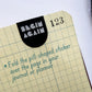 Close-up of Pills for Life sticker folded over notebook page